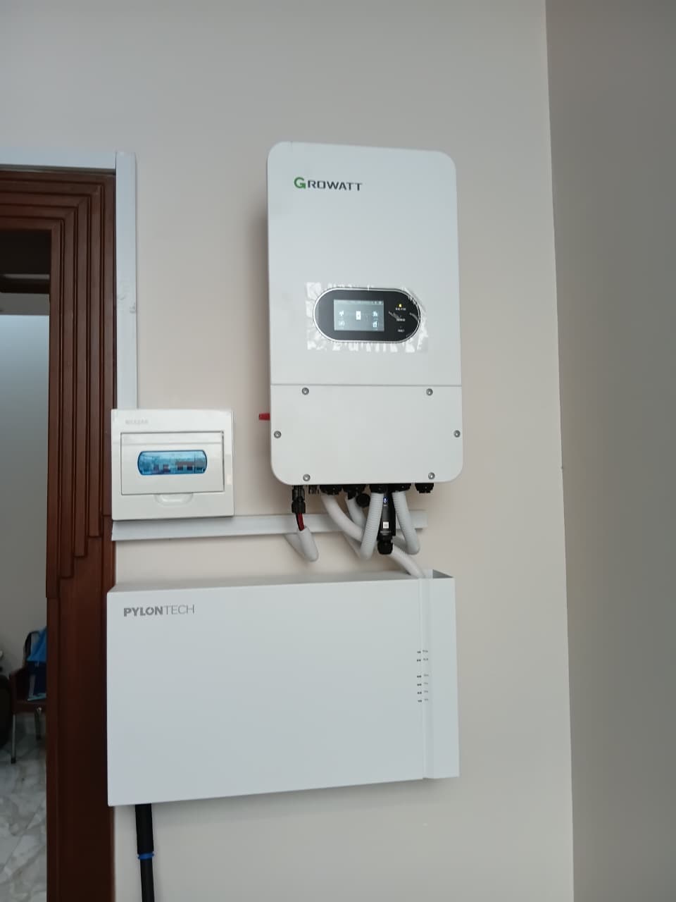 Solar inverter and battery setup installed indoors